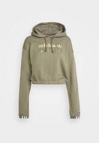 Olive green cropped hoodie with long sleeves, drawstring hood, elastic hem, and gold Adidas logo on chest.