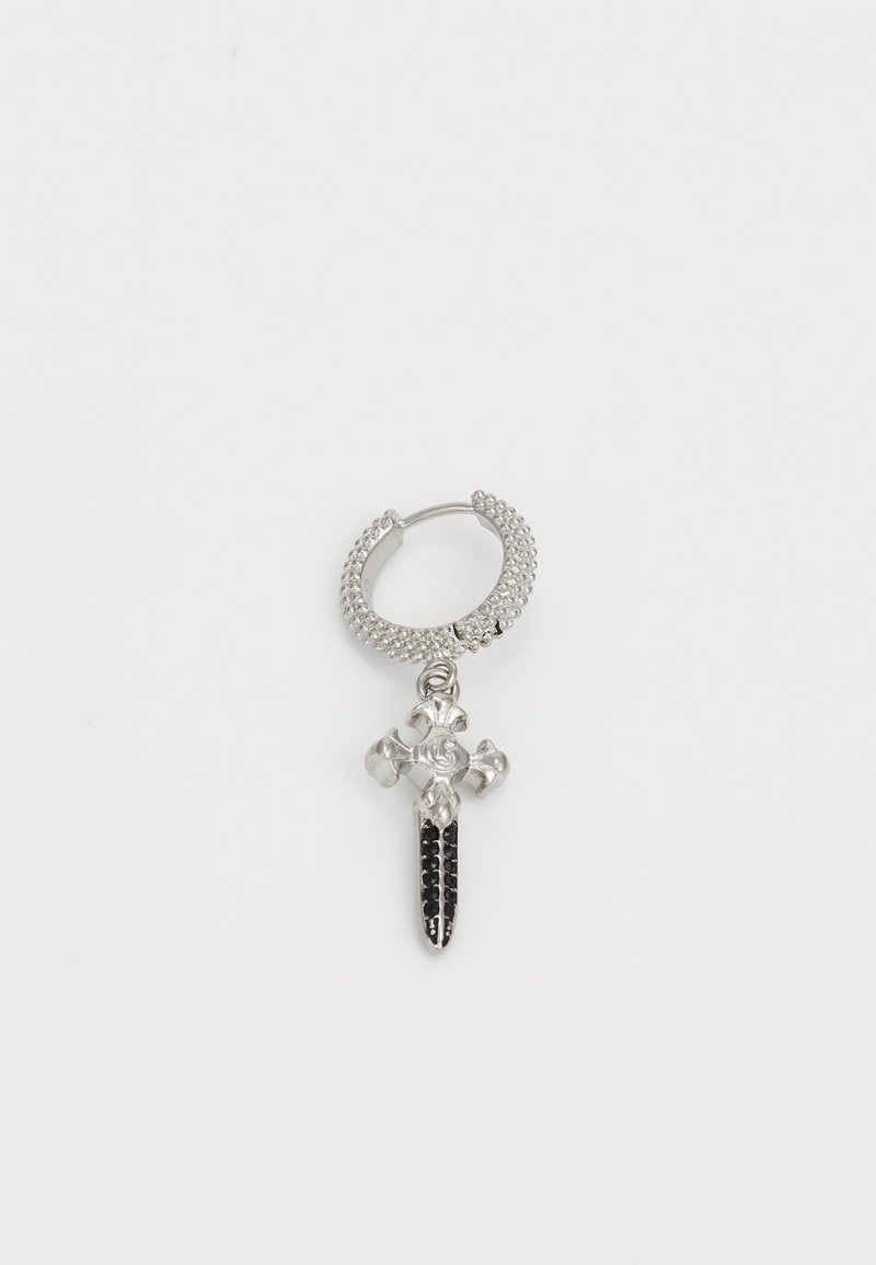 Silver hoop earring featuring a cross pendant with black stones and floral accents, combining textured and polished surfaces in a bold design.