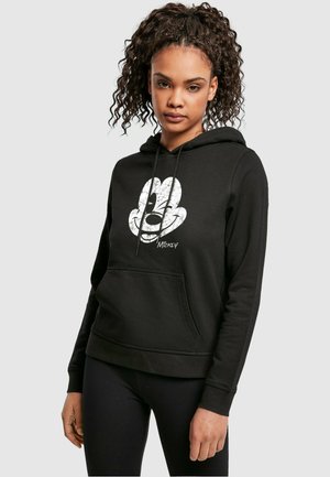 Black hoodie made of cotton, featuring a large, vintage-style Mickey Mouse graphic in white on the front. Includes a front pocket and drawstring hood.