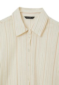 Cream button-up shirt with beige and gold vertical stripes and a classic collar, size small by Calliope, shown folded.