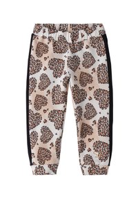 Pantalons de jogging imprimé léopard en beige, avec des bandes latérales noires et une taille froncée. Tissu doux avec des motifs de coeurs et de léopards.
