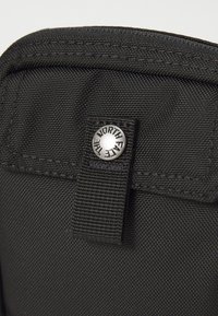 The North Face REDBOX SMALL CARRY BAG UNISEX - Axelremsväska - black
