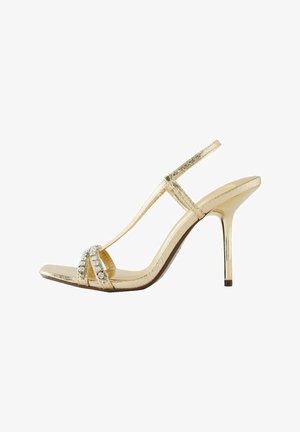 Gold metallic high-heel sandal with a T-strap design, embellished with clear rhinestones on the front, featuring a square toe and a sleek stiletto heel.