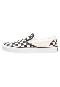 Chaussures Vans slip-on à carreaux noir et blanc avec une tige en toile, une semelle blanche et des détails de couture noire le long du bord.