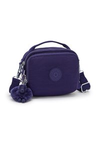 Compact purple shoulder bag with multiple zip compartments, top handle, adjustable strap, and plush gorilla keychain attached.
