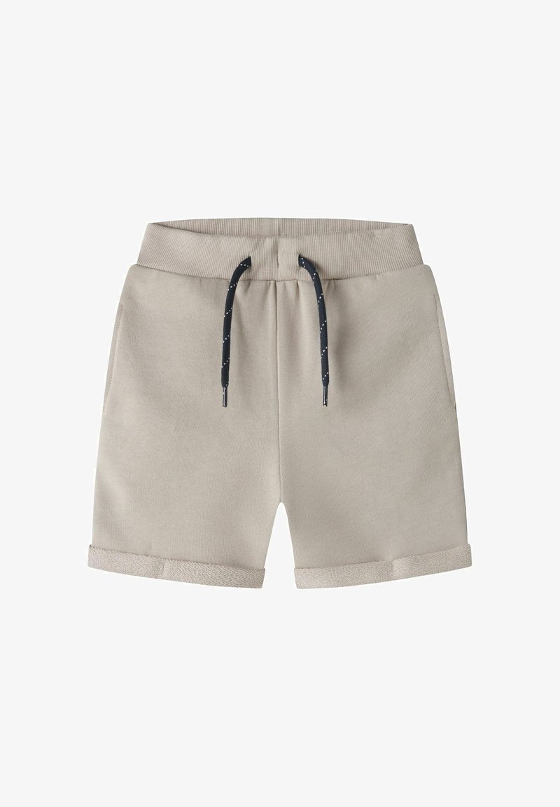 Shorts en coton beige avec une taille à cordon, des liens bleu foncé et des revers roulés ornés d'une bande d'accent texturée à l'ourlet.