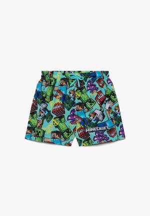 Pantaloncini turchesi brillanti con stampa a tema Minecraft che include personaggi, Creeper, blocchi di TNT e un laccio intrecciato in vita.