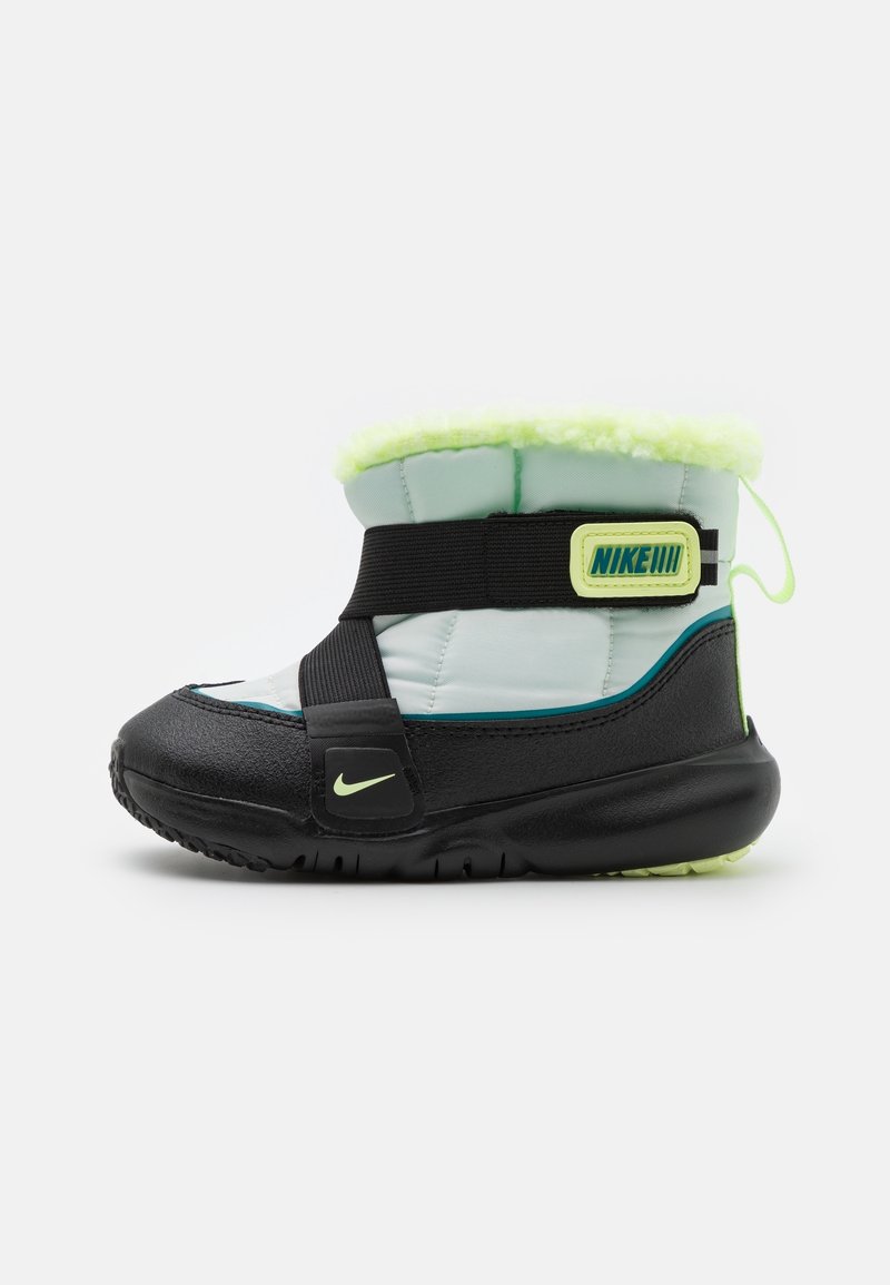 Black and light blue winter boot with a green fur lining, adjustable black strap, and neon yellow accents; rubber sole with grip.