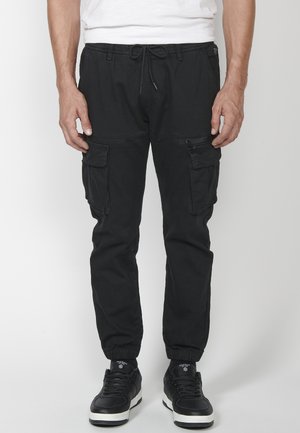 JOGGER  - Donji dijelovi trenirke - black