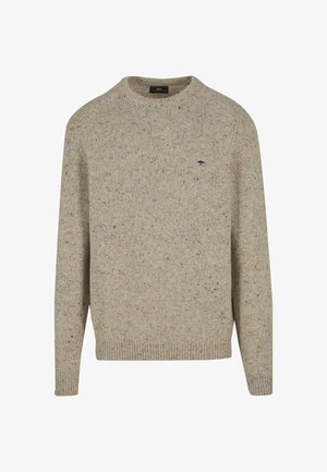 Svetre v svetlo rjavi barvi iz teksturirane preje z majhnimi madeži. Ima okroglo ovratnico ter rebraste manšete in rob. Majhna oznaka na prsih.