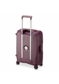 Purple hard-shell suitcase with a textured finish, extendable silver handle, four wheels, and a recessed lock on the side.