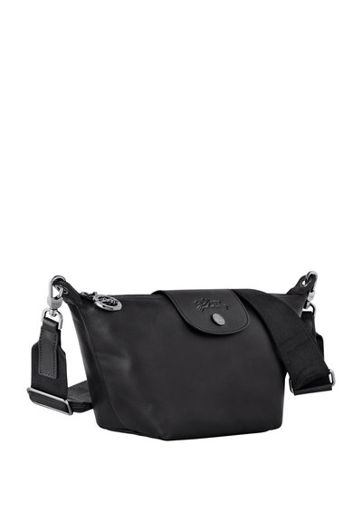Black leather bag with a smooth texture, oval shape, a front flap with a button closure, and an adjustable strap. Silver hardware accents.