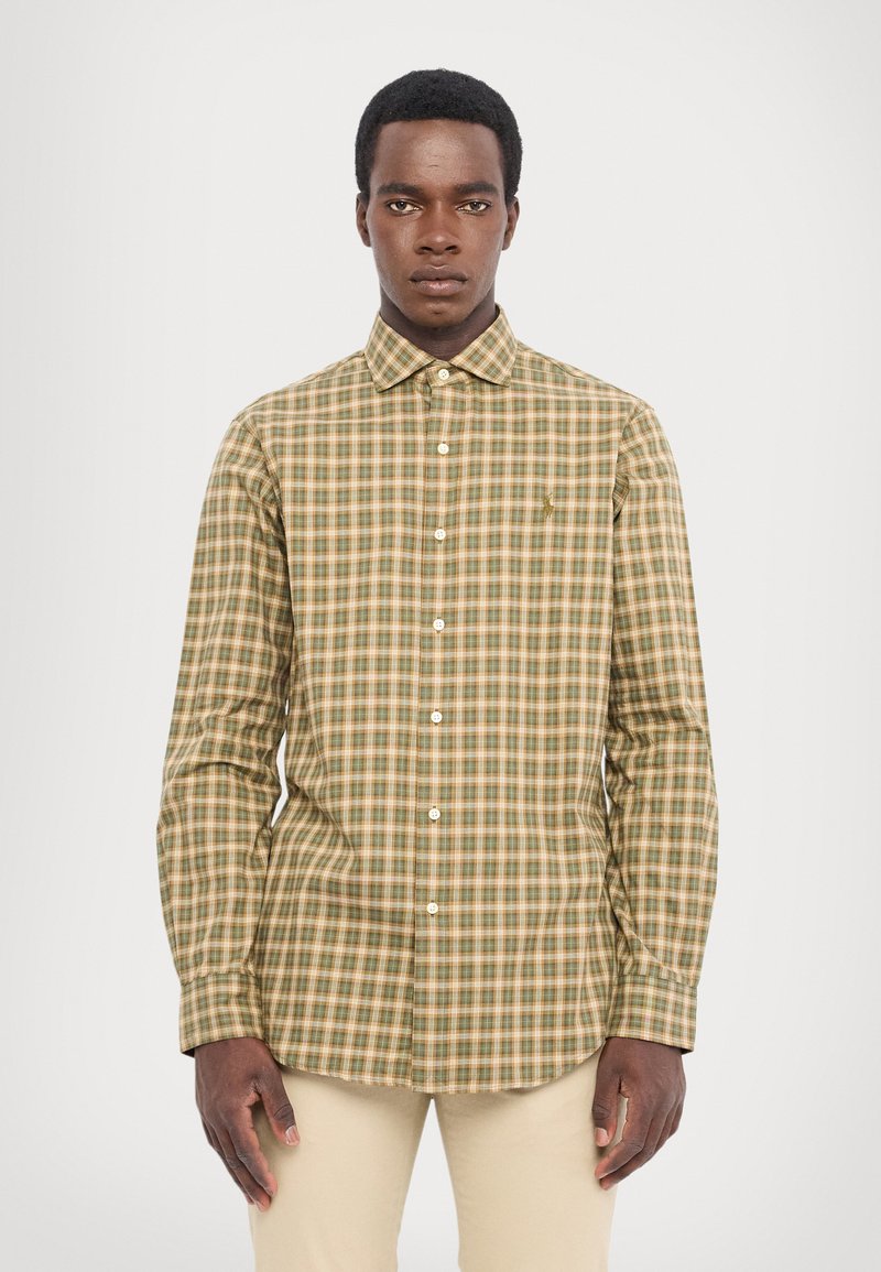 Green and tan checkered shirt with long sleeves, button-down collar, and a chest pocket. Fabric texture appears smooth with subtle sheen.