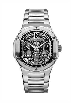 Orologio in acciaio inox silver con quadrante skeleton, dettagli neri e funzioni cronografo. Cassa ottagonale e design del bracciale a maglie.