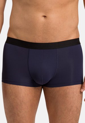 Dark navy boxer briefs made of smooth fabric. Features a black elastic waistband with brand name, snug fit, and mid-thigh cut.