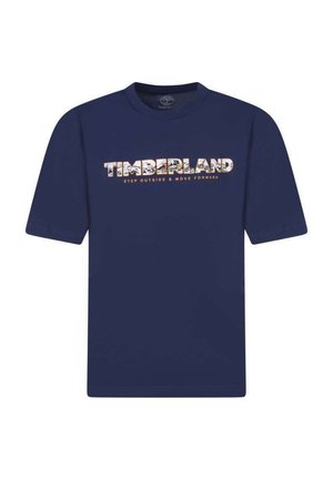T-shirt en coton bleu marine avec le mot "TIMBERLAND" en lettres décorées et la phrase "SORTEZ ET AVANCEZ" en dessous.