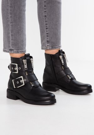 Botines camperos - black