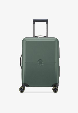 Green hard-shell suitcase with four yellow-trimmed spinner wheels and extended black telescopic handle, front view on white background.