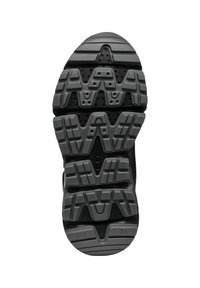 Black rubber shoe sole featuring a textured tread pattern with geometric shapes and perforations for breathability.