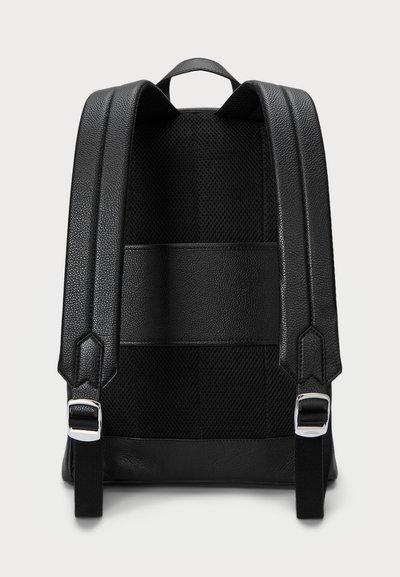 Black leather backpack featuring padded mesh straps, a flat back, and silver hardware accents. Smooth texture with structured design.