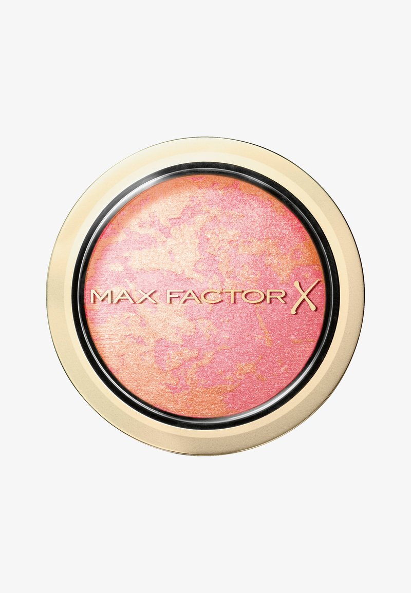 Max Factor X blush i en rund guld- og sort kompakt. Har en marmorering med nuancer af pink og fersken. Glat finish.