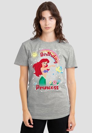 Gray t-shirt featuring a colorful graphic of a mermaid with red hair, text that reads "Birthday Princess," and decorative elements like flowers and sunshine.
