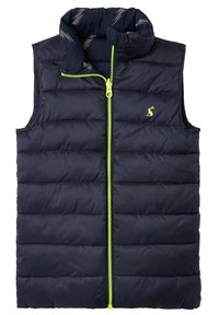 Laivastonsininen eristävä liivi, jossa on korkea kaulus, etuvetoketju kirkkaan vihreänä ja tikattu kuvio. Sisäpuolella on salamanrinnakkaiskuvio.