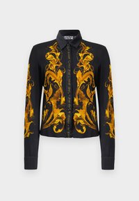 Juodas ilgomis rankovėmis mygtukinis marškiniai su puošniais auksiniais baroko gėlių raštais priekyje, rankovėse ir apykaklėje, Versace Jeans Couture ženklas.