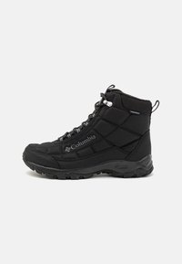 Black waterproof high-top boots with quilted texture, textured sole, and contrasting laces. Features logo on the side and reinforced ankle.