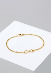 Goldplattiertes Armband mit einem filigranen Kettendesign und einem Unendlichkeitssymbol als Mittelpunkt sowie einem sicheren Verschluss.