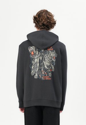 Black hoodie made of soft material, featuring a graphic design of two fierce wolves and a character, with colorful accents on the back.