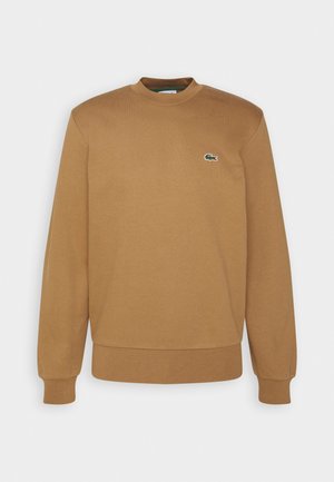 Bruine katoenen sweatshirt met een ronde halslijn, geribde boorden en een klein groen krokodil logo op de borst. Glad textuur, relaxte pasvorm.