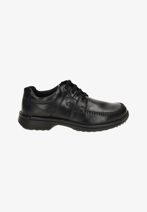Men’s black leather lace-up casual shoe with moc toe stitching and cushioned sole, shown in side profile on white background.