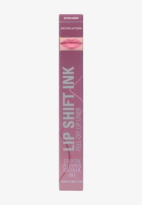 Lip Shift Ink peel-off leppenn i en lilla eske merket "Bitten Cherry," med sølvtekst og en leppeillustrasjon på forsiden.