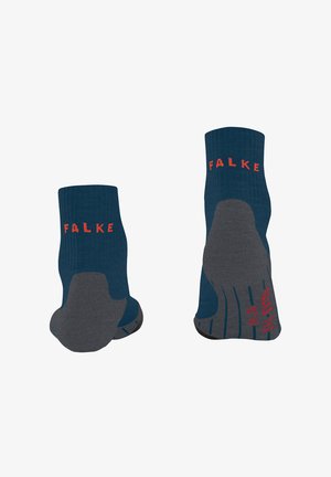Blaue und graue Socken mit geripptem Muster, verstärkten Sohlen und rotem "FALKE"-Logo auf der Oberseite.