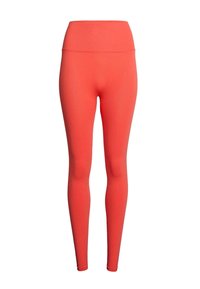 Leggings corallo con vita alta, realizzati in tessuto elasticizzato. Texture liscia, design aderente e senza motivi o accenti visibili.