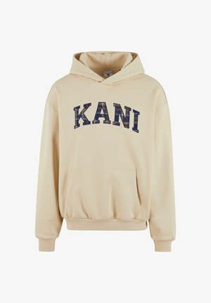 Világosbarna kapucnis pulóver, puha anyagból, kenguru zsebbel, amelyen nagy, sötétkék "KANI" grafika található a mellkason.