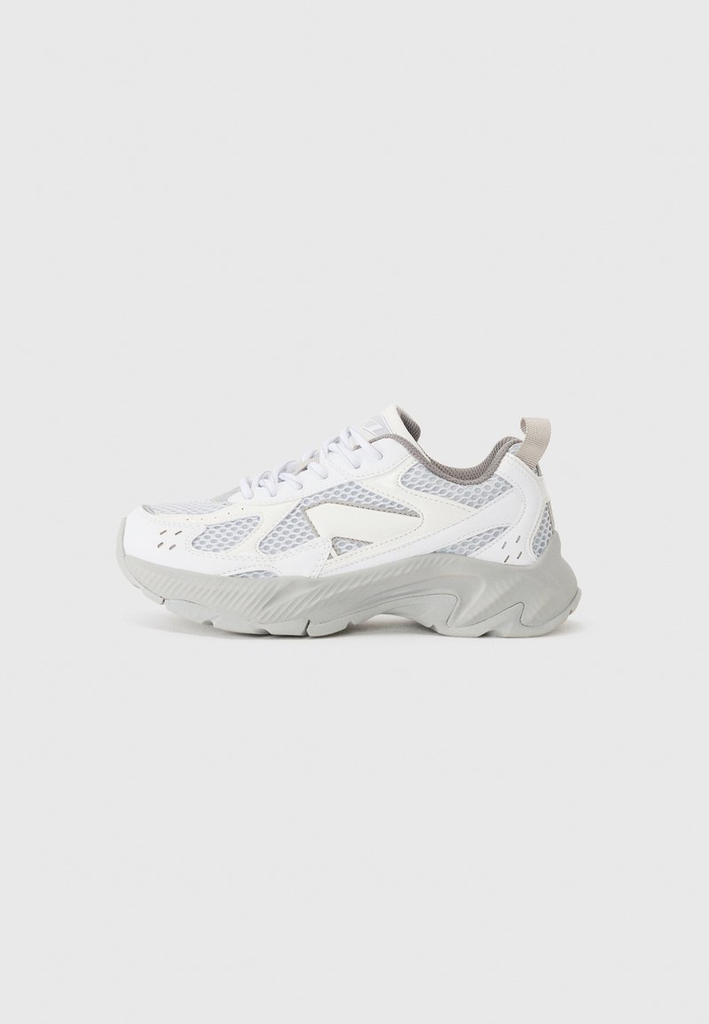 White athletic shoe with mesh detailing, grey accents, a chunky sole, and a padded tongue. Curved design with multiple ventilation holes.