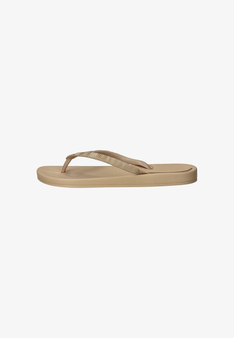 Beige flip-flop met een textuurzool, smalle banden met een golvend patroon en een plat ontwerp. Gemaakt van zacht, flexibel materiaal.