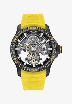 Čierne a žltofarebné automatické hodinky polície so zreteľnými vnútornými ozubenými kolieskami a mechanizmami, žltým gumovým remienkom a bielymi hodinovými značkami.