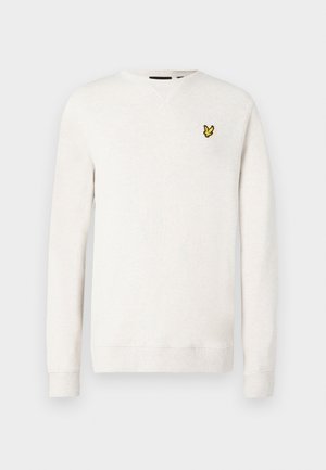 Light beige sweatshirt with a crew neckline, long sleeves, and a small yellow embroidered logo on the chest. Soft texture and casual design.