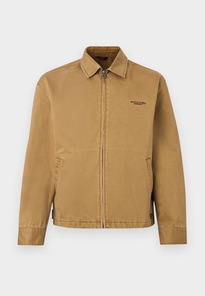 Giacca marrone chiaro con zip, colletto, due tasche laterali e piccolo logo "Jack & Jones Premium" sul lato sinistro del petto.