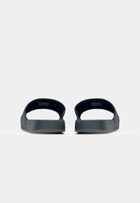 Dark blue slip-on sandals with a smooth, matte finish, open back, and textured soles for grip. Simple design and lightweight material.