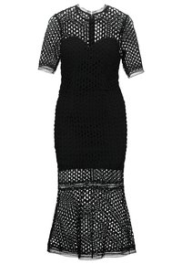 Černé krajkové šaty s přiléhavým tělem, krátkými rukávy a rozšířeným lemem. Složitý geometrický vzor po celé látce. Výstřih ve tvaru klíčové dírky.
