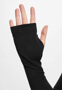 Fekete, hosszú ujjú, ujjak nélküli dizájnnal, puha, rugalmas anyagból készült. Zökkenőmentes mandzsettával és sima felülettel rendelkezik.