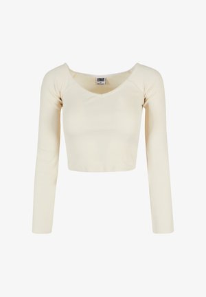 Cremefarvet langærmet cropped top med scoop-neck, ribbet tekstur og en størrelse XS Urban Classics etiket indeni kraven.