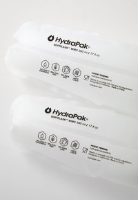 HydraPak SoftFlask WMX, 500 ml, translucent silicone with printed labels detailing features, icons, and patent information on a white background.