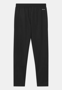 Zwarte sportlegging met een gladde, gestructureerde stof, een elastische tailleband en een discreet logo aan de linkerkant. Eenvoudig, aansluitend ontwerp.