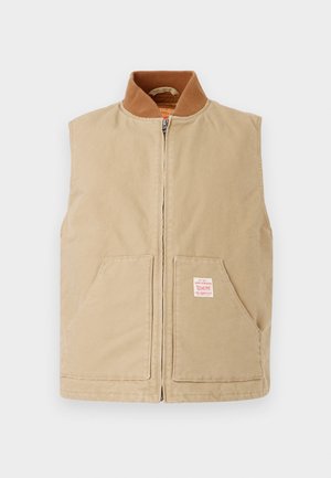 Sleeveless beige zip-up vest with brown ribbed collar, two front pockets, and small white label on right pocket.