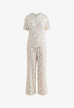 Hvid kortærmet top og bukser i pyjamas med farverige små tryk af sløjfer, kroner, stjerner, blomster og hestesko.
